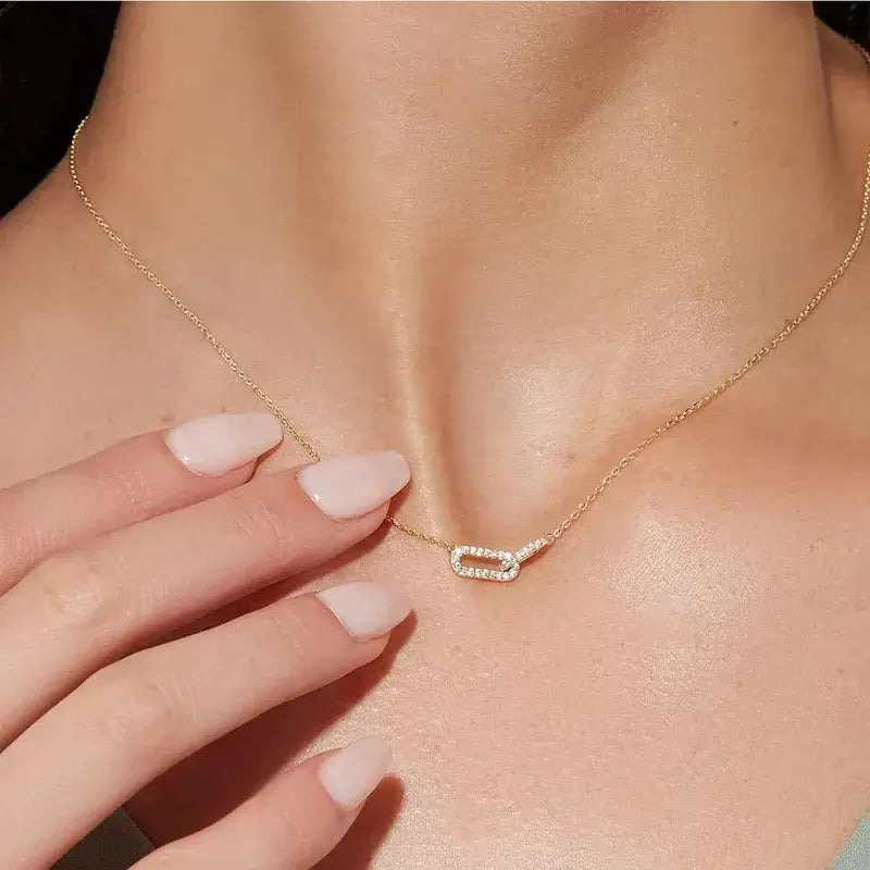 Elegant oval zircon necklace displayed on jewelry stand