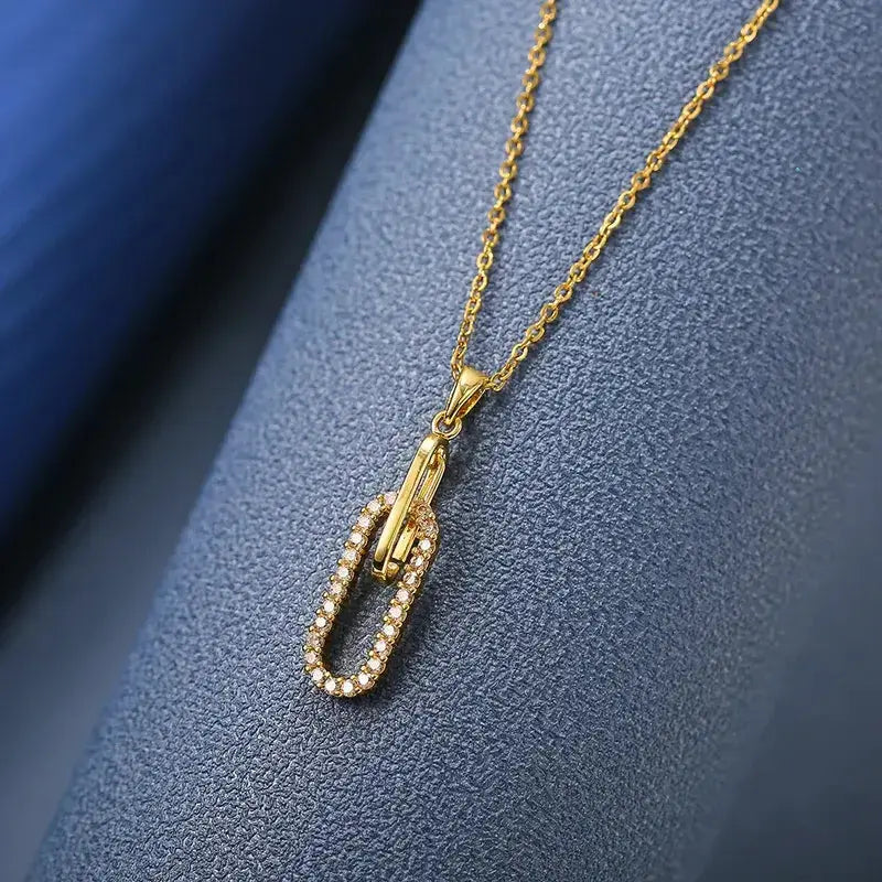 Close-up of Paper Clip Pendant Necklace with sparkling zircon