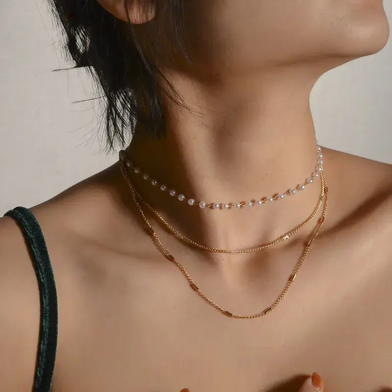 Elegant multi-layer choker necklace styled with evening dress
