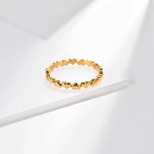 Heart-shaped ring on a white background