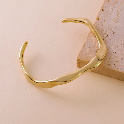 Gold Geometric Bracelet on a white background