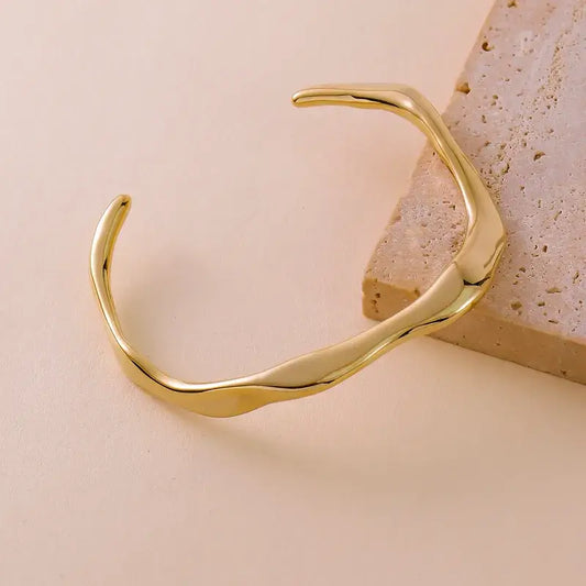 Gold Geometric Bracelet on a white background