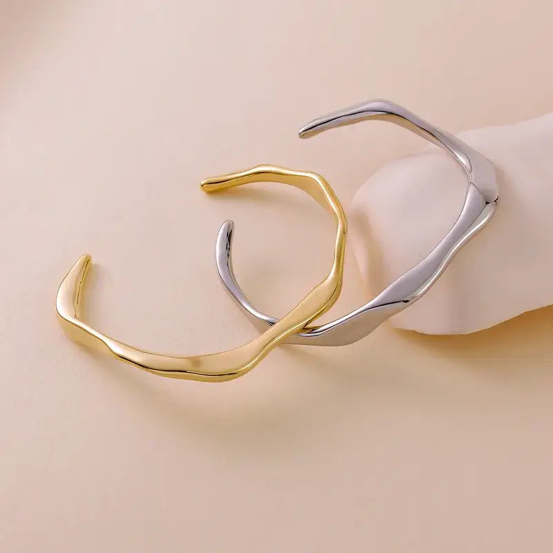 Stylish Gold Geometric Bracelet paired with rings and bangles