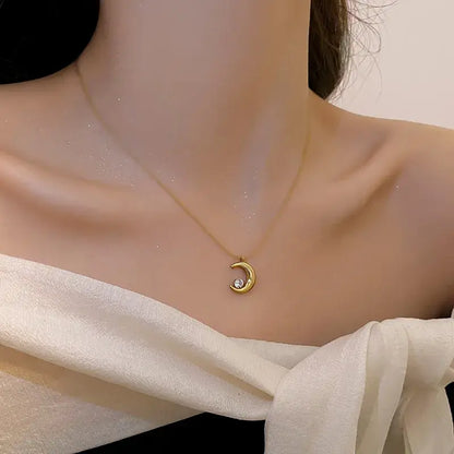 Gold moon pendant necklace worn by model for everyday or tea party wear