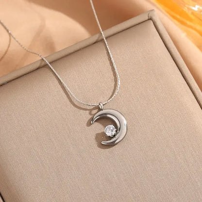 Close-up of Gold moon pendant necklace showing moon-shaped zircon pendant