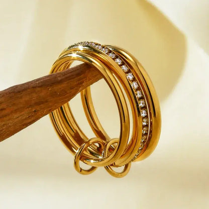 Stacked stainless steel rings with round 18K gold plated design