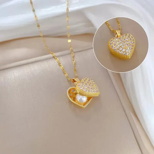 Close-up of Gold heart pendant necklace with acrylic charm