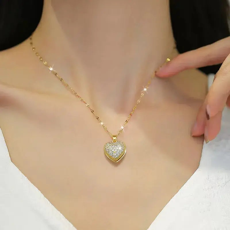 Gold heart pendant necklace with acrylic charm worn by model for daily or party wear
