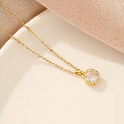 Close-up of square pendant necklace showing polished stainless steel pendant