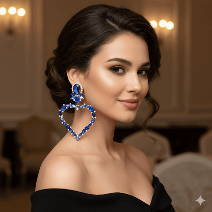 Luxurious heart-shaped drop earrings worn by a model showcasing elegance and sparkle in a formal setting.