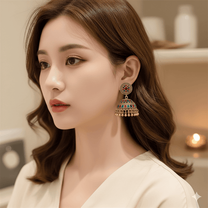 Retro water drop tassel earrings showcasing a vintage design with colorful accents worn by a woman.