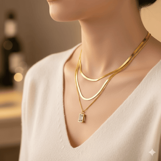 18K gold U-shape pendant necklace worn elegantly with layered gold chains on a woman's neck.