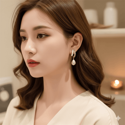 Elegant woman wearing square heart bow earrings with pearls and rhinestones, showcasing stylish jewelry for women.