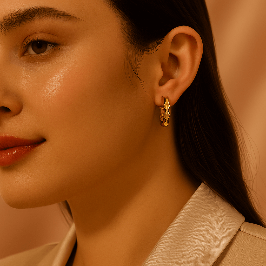 Female model wearing simple gold-plated earrings with stylish outfit