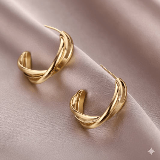 Twisted stud earrings featuring a chic spiral design on a soft satin background, perfect for minimalist jewelry lovers.