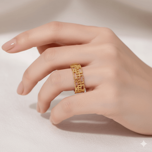 Gold plated geometric open ring displayed on a hand, showcasing its stylish and modern design.