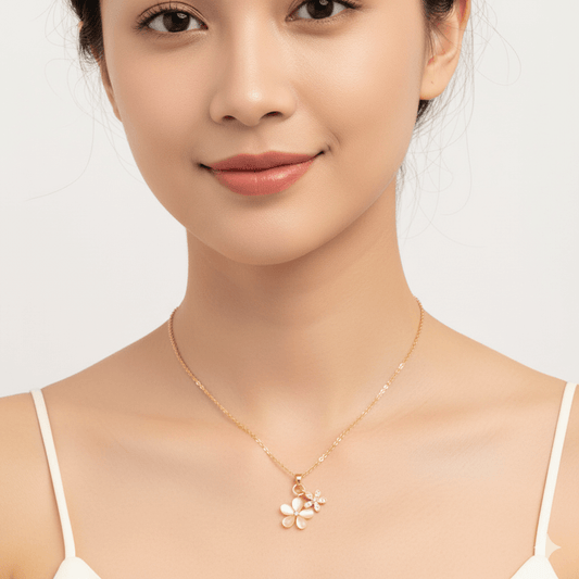 Romantic Gold Necklace – 18K Gold Plated Heart Pendant for Women worn by a woman, showcasing a floral design.