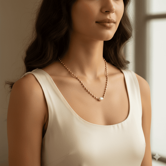 Gold plated pendant necklace waterproof worn by a woman with a classic pendant design in a stylish setting.