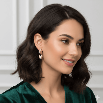 Geometric hairpin stud earrings in 18K gold worn by a woman with a chic hairstyle, showcasing modern style.