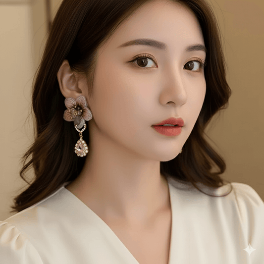 Geometric Bow Knot Earrings – Elegant Pearl & Zircon Design worn by a model, showcasing charm and style.