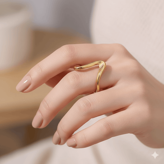 Gold plated geometric ring for women worn on a hand showing a chic and modern design.