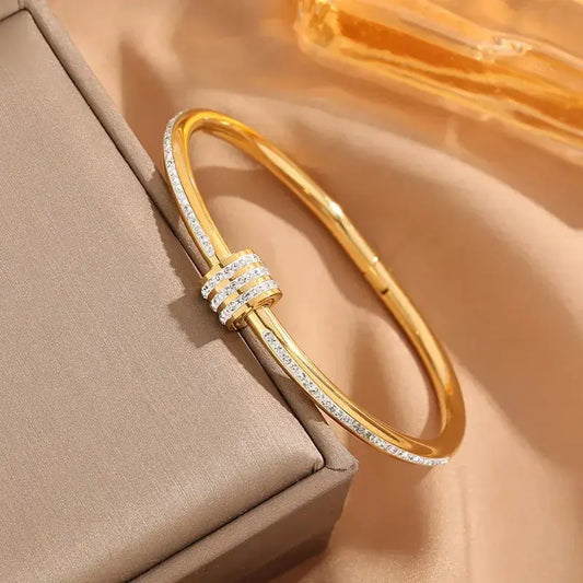 Close-up of Simple Round Titanium Steel Bangle showing 18K gold plating