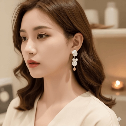 Close-up of a woman wearing summer shell tassel earrings with a chic, elegant design.